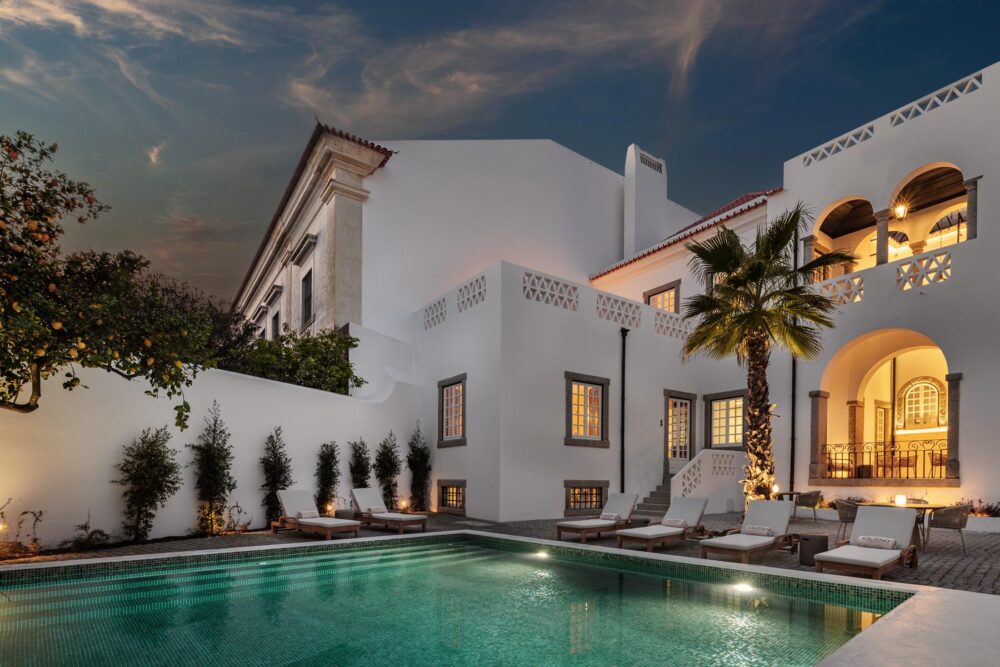 Outdoor patio with a pool and lounge area of the Cicioso Boutique Hotel after the rehabilitation. 